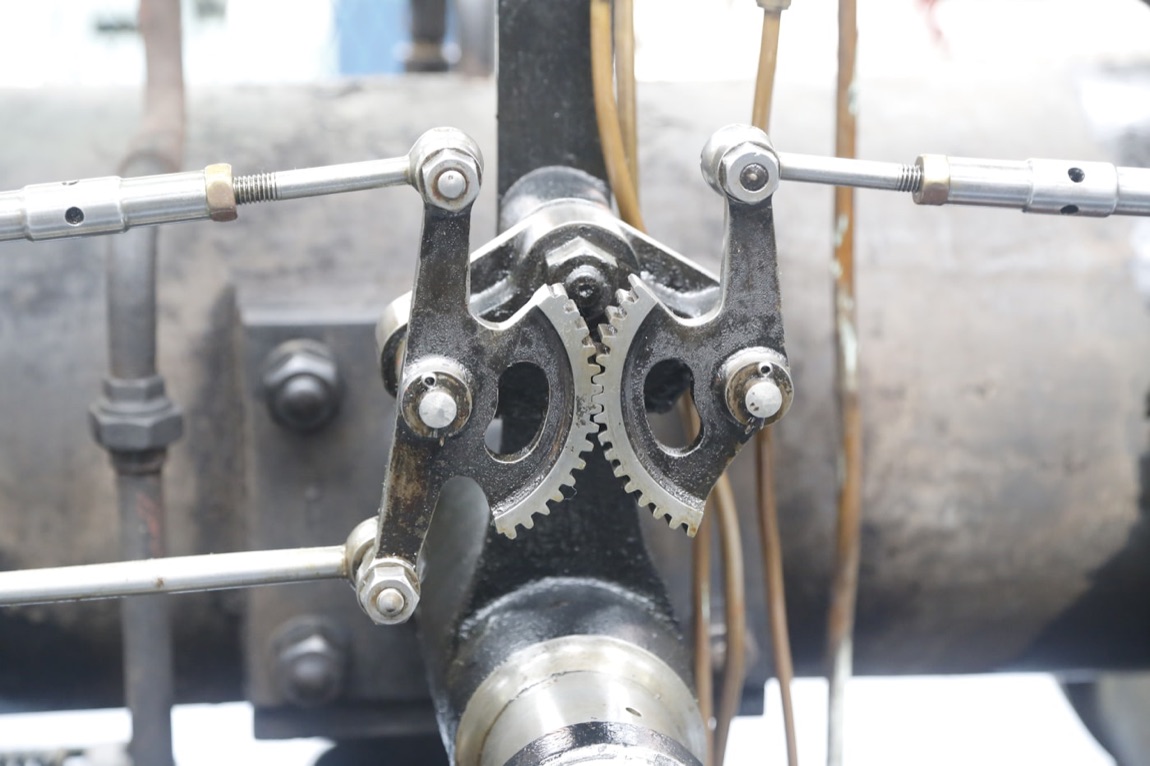 Interlocking metal gears turning together like a well-tuned CI/CD pipeline
