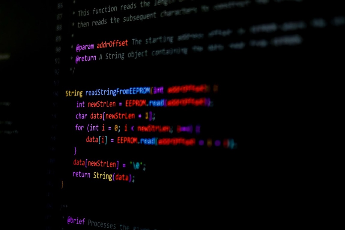 Source code glowing on a dark terminal screen during a CI job